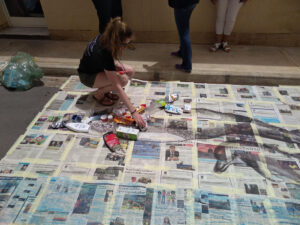 Placing the trash in the dolphin